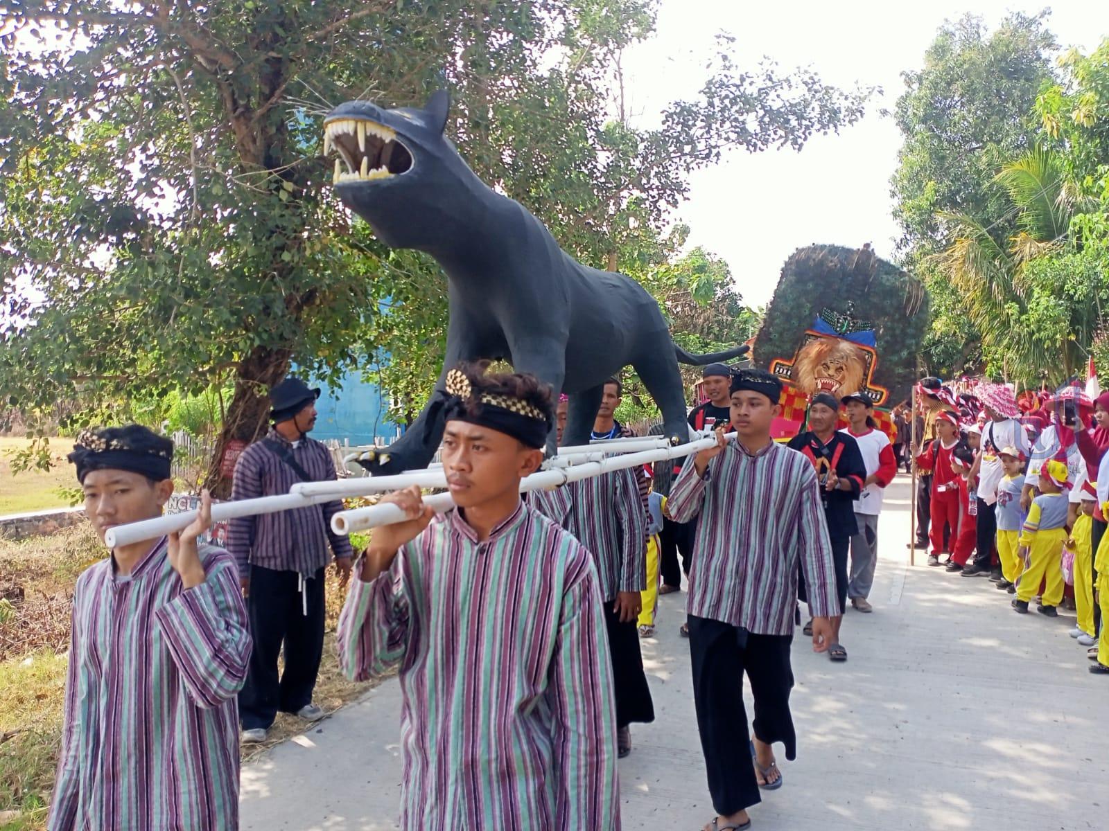 Kirab Macan Kembar Awali Prosesi Pagelaran Mukti Aji Dadi Siji Desa Jatigembol Kedunggalar Ngawi